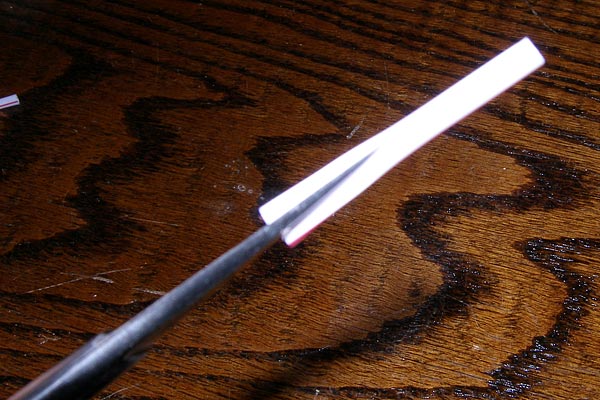 Cut a slit in the straw Cut a slit in the straw